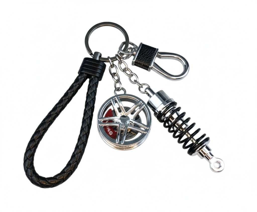 Llavero turbo deportivo con rueda y amortiguador – Accesorio metálico con cuerda trenzada y caja de regalo