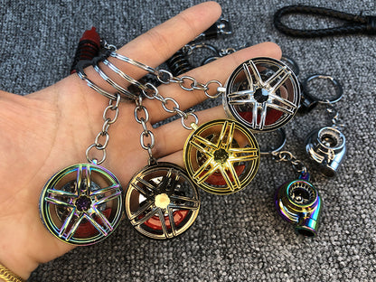 Llavero turbo deportivo con rueda y amortiguador – Accesorio metálico con cuerda trenzada y caja de regalo