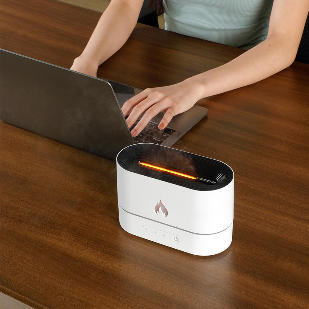 Difusor aromático con efecto llama y humidificación ultrasónica con luz ambiental LED.