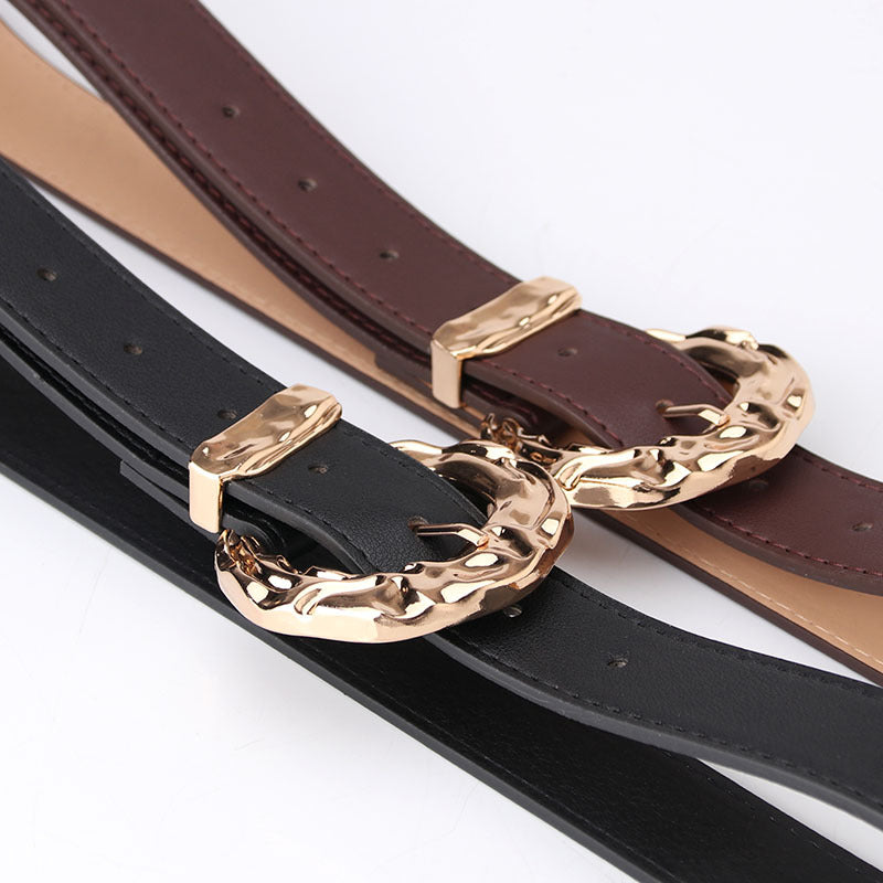 Cinturón unisex de PU con hebilla clásica de pasador, diseño minimalista y acabado moderno disponible en varios colores.
