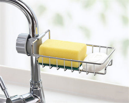 Organizador ajustable de fregadero en acero inoxidable y ABS para utensilios, esponjas y jabones.