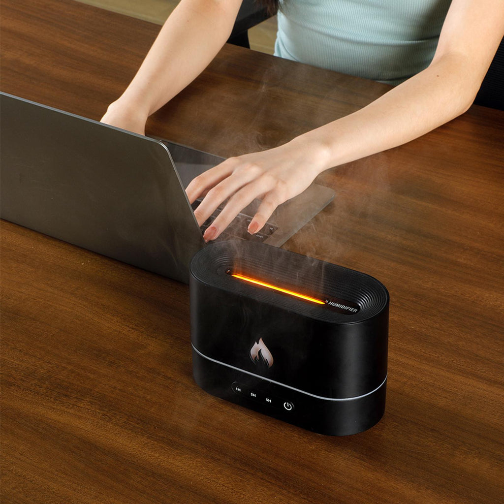 Difusor aromático con efecto llama y humidificación ultrasónica con luz ambiental LED.