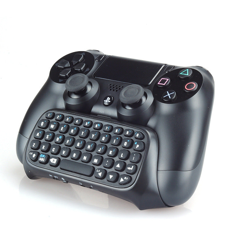 Teclado Bluetooth integrado para mando PS4, diseño compacto en ABS con teclas dedicadas, batería de litio 200 mAh y conexión inalámbrica estable para mensajería y navegación.