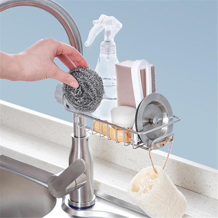 Organizador ajustable de fregadero en acero inoxidable y ABS para utensilios, esponjas y jabones.