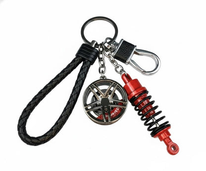 Llavero turbo deportivo con rueda y amortiguador – Accesorio metálico con cuerda trenzada y caja de regalo