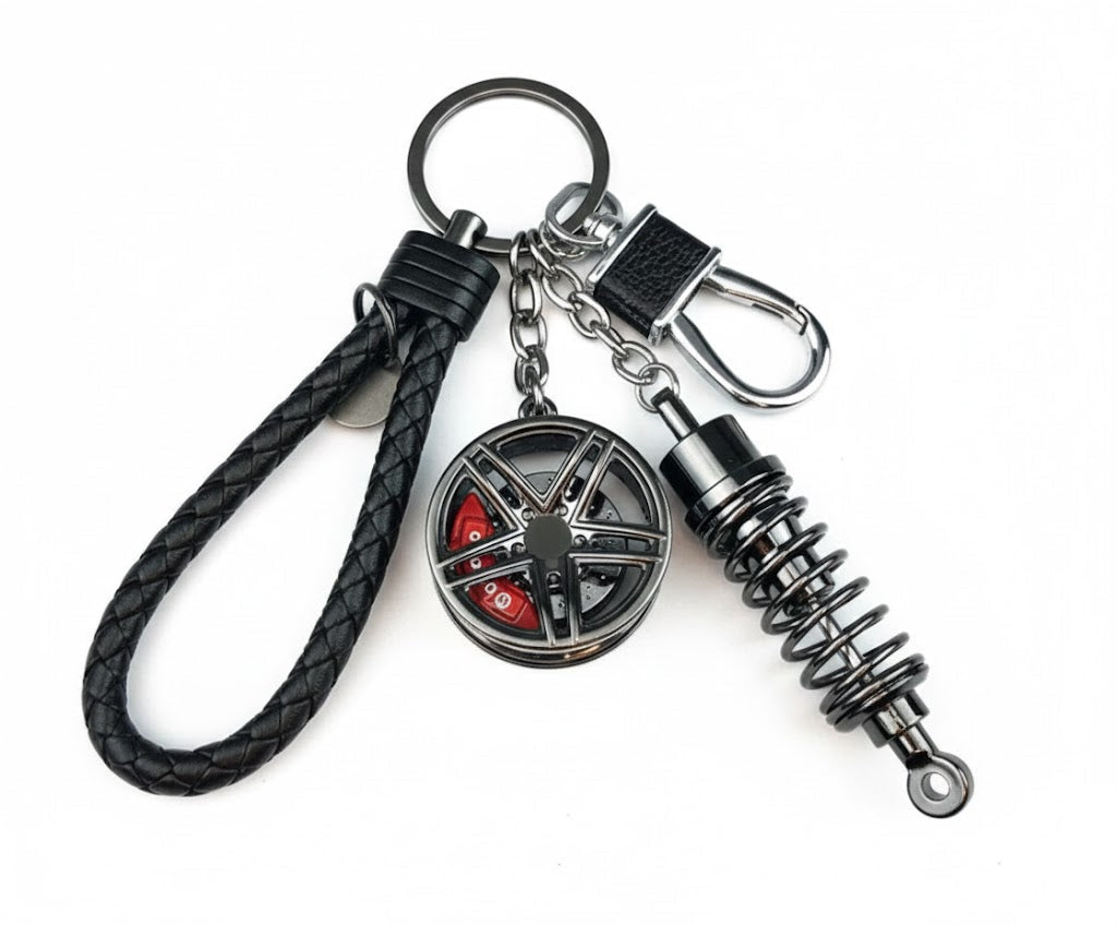 Llavero turbo deportivo con rueda y amortiguador – Accesorio metálico con cuerda trenzada y caja de regalo