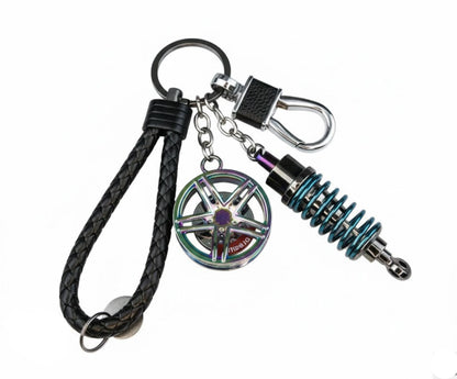 Llavero turbo deportivo con rueda y amortiguador – Accesorio metálico con cuerda trenzada y caja de regalo